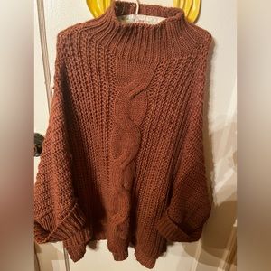 Mock turtle neck sweater with dolman sleeves. Never worn